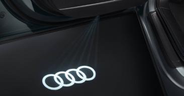 203 EUR LED Audi gredzeni iekāpšanas zonai Iekāpšanas zonā projicē Audi logo un